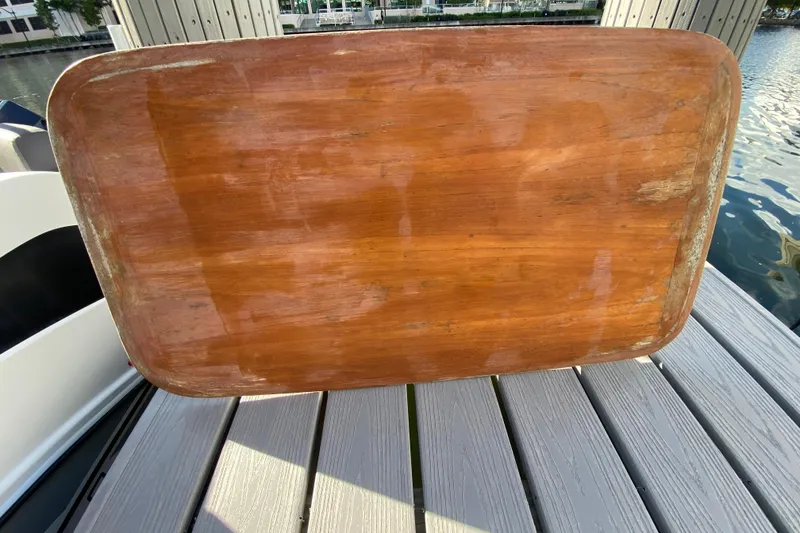 Slide: The Image of Wooden table on a dock, near a 2022 Beneteau Antares 8 boat. - 45