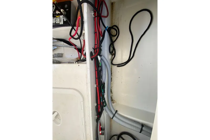 Slide: The Image of Interior wiring of 2022 Beneteau Antares 8 boat, showcasing cables and ropes. - 47