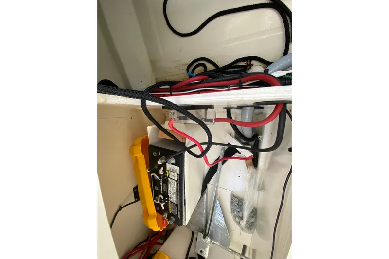 Slide: The Image of Battery compartment of 2022 Beneteau Antares 8 with wiring and anchor. - 48