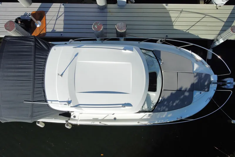 Slide: The Image of Overhead view of 2022 Beneteau Antares 8 docked at a marina. - 53