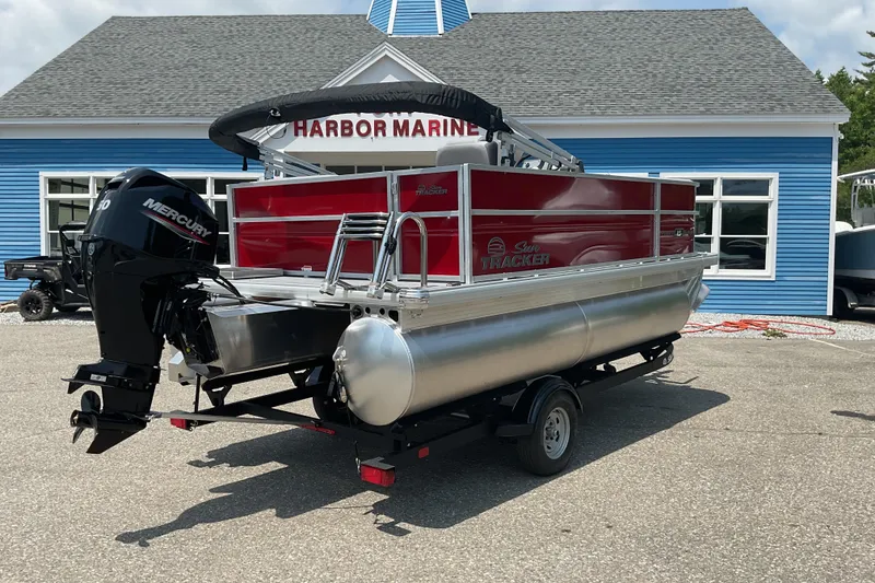 Slide: The Image of 2026 Sun Tracker Party Barge 16 DLX pontoon boat at Harbor Marine dealership. - 3