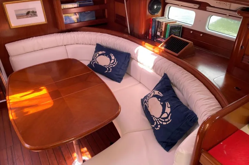 Slide: The Image of Luxurious interior of 2001 Beneteau Oceanis 411 yacht with elegant seating and nautical decor. - 7