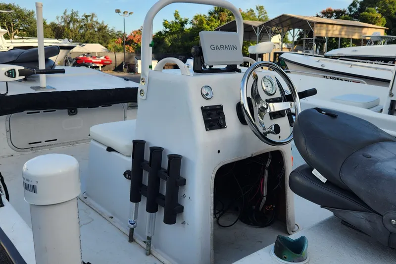 Slide: The Image of 1997 Polar 1700 Skiff boat interior with Garmin navigation and steering console. - 5