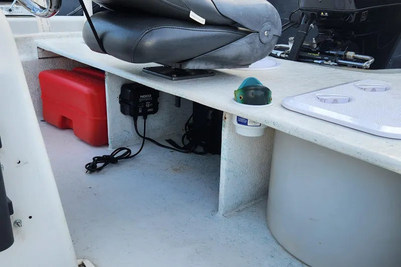 Slide: The Image of Interior of a 1997 Polar 1700 Skiff boat with storage compartments and seating. - 6