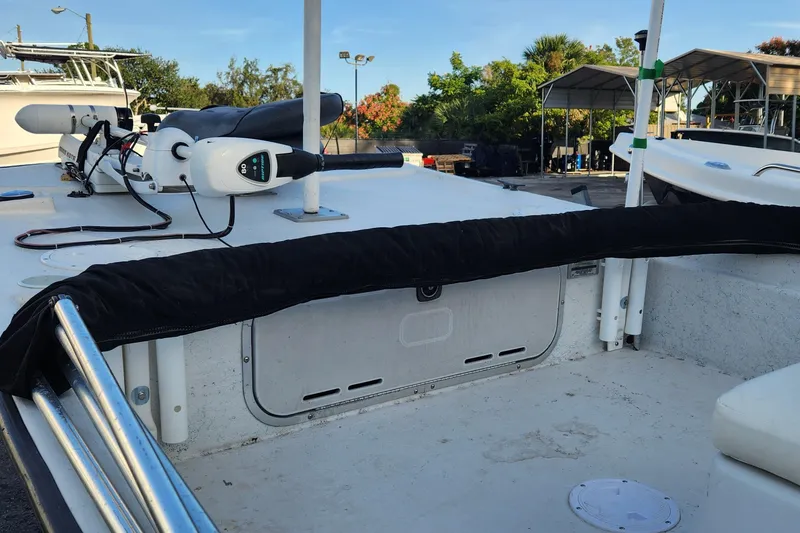 Slide: The Image of 1997 Polar 1700 Skiff boat interior with trolling motor and covered railing. - 9
