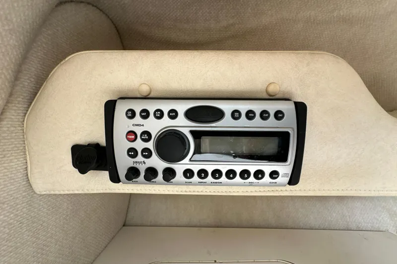 Slide: The Image of Radio control panel in a 2007 Sea Ray 225 Weekender boat interior. - 22