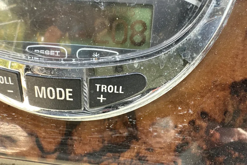 Slide: The Image of Close-up of a 2007 Sea Ray 225 Weekender boat control panel with mode and troll buttons. - 23