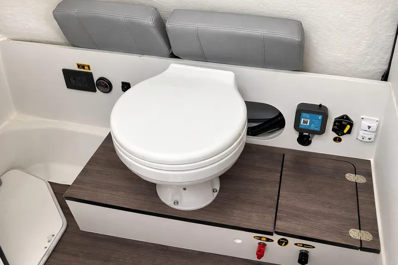 Slide: The Image of 2024 Beneteau Flyer 8 SPACEdeck V2 boat toilet with control panel and storage. - 18