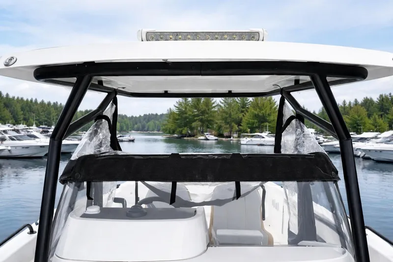 Slide: The Image of 2024 Beneteau Flyer 8 SPACEdeck V2 boat docked in a scenic marina. - 8