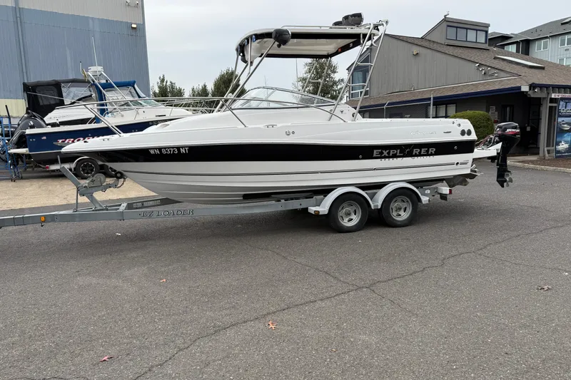 The Image of 2006 Campion Explorer 602i Sport Cabin boat on trailer, parked outdoors. - 0