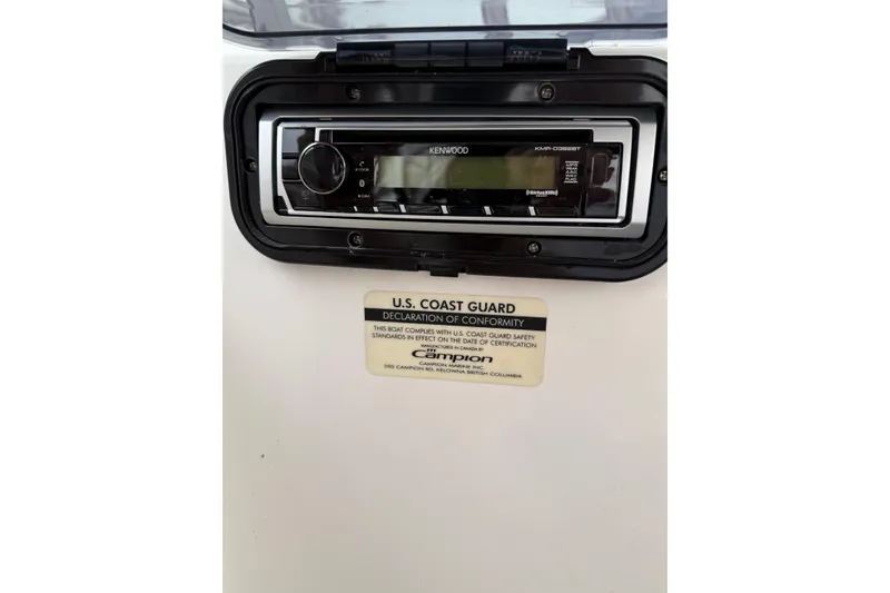 Slide: The Image of Kenwood stereo system on 2006 Campion Explorer 602i Sport Cabin with U.S. Coast Guard certification. - 15