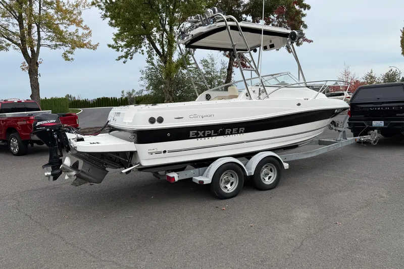 Slide: The Image of 2006 Campion Explorer 602i Sport Cabin boat on trailer, parked outdoors. - 2