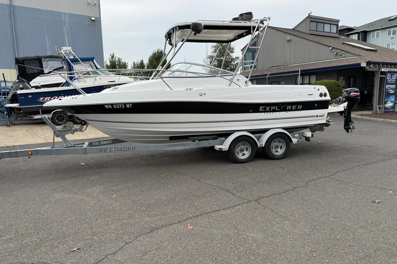 Slide: The Image of 2006 Campion Explorer 602i Sport Cabin boat on trailer, parked outdoors. - 3