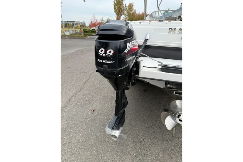 Slide: The Image of 2006 Campion Explorer 602i Sport Cabin with Mercury 9.9 Pro Kicker outboard motor. - 4