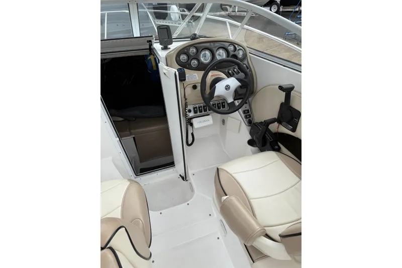 Slide: The Image of 2006 Campion Explorer 602i Sport Cabin interior with steering wheel and dashboard controls. - 5