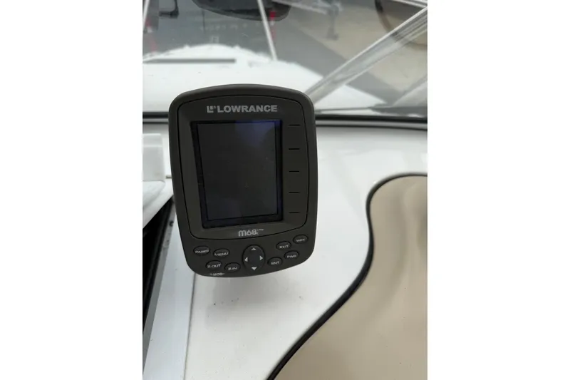 Slide: The Image of Lowrance M68 fishfinder on 2006 Campion Explorer 602i Sport Cabin boat dashboard. - 6