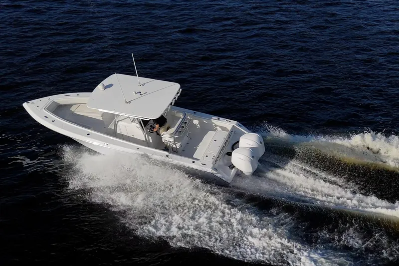Slide: The Image of Aerial view of 2005 Jupiter 27 boat cruising on open water. - 10