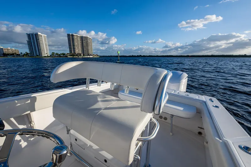 Slide: The Image of 2005 Jupiter 27 boat interior with ocean view and distant buildings. - 32