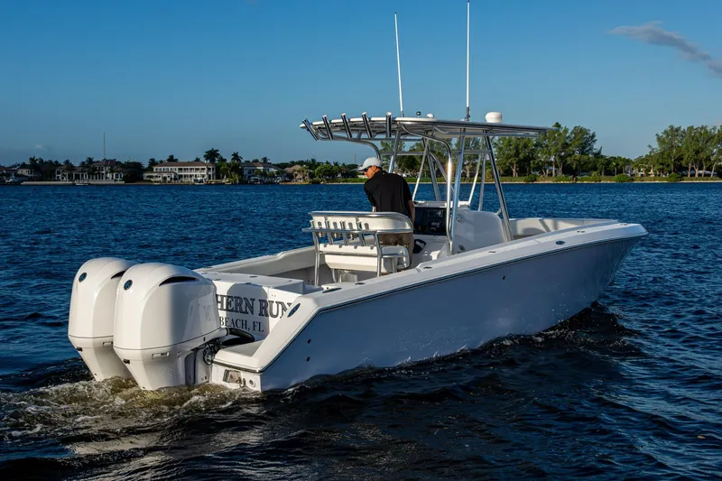 Slide: The Image of 2005 Jupiter 27 boat cruising on a sunny day with dual engines. - 37