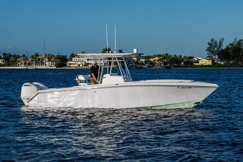 Slide: The Image of 2005 Jupiter 27 boat cruising on a calm blue waterway. - 43