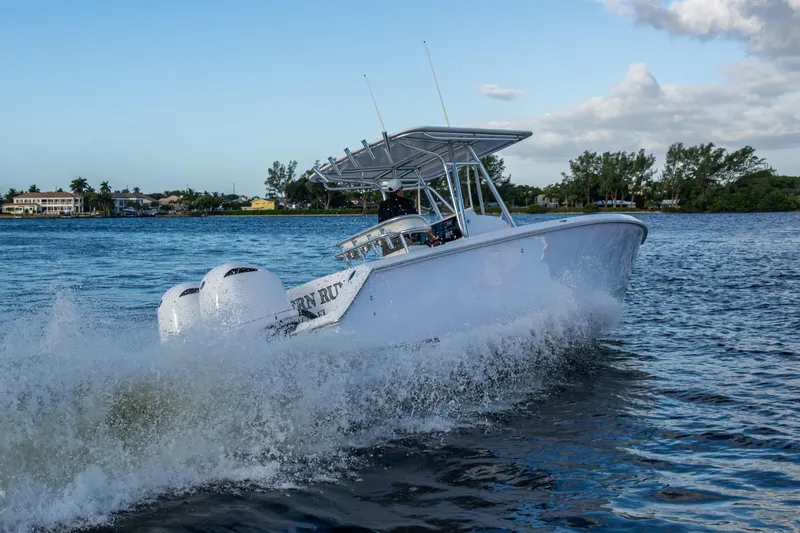 Slide: The Image of Jupiter 27 boat from 2005 cruising on a scenic waterway. - 63