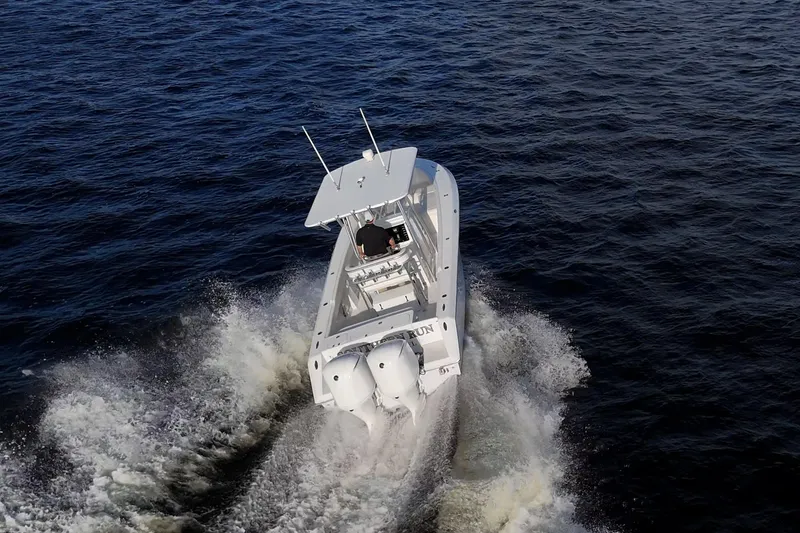 Slide: The Image of Aerial view of 2005 Jupiter 27 boat cruising on open water. - 8