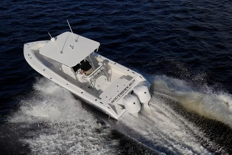 Slide: The Image of 2005 Jupiter 27 boat cruising on open water, aerial view. - 9