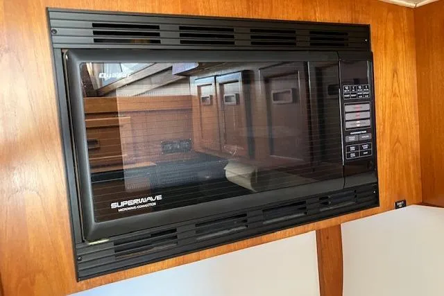 Slide: The Image of Built-in microwave in 1979 Pacemaker 40 Sportfisher boat interior. - 10
