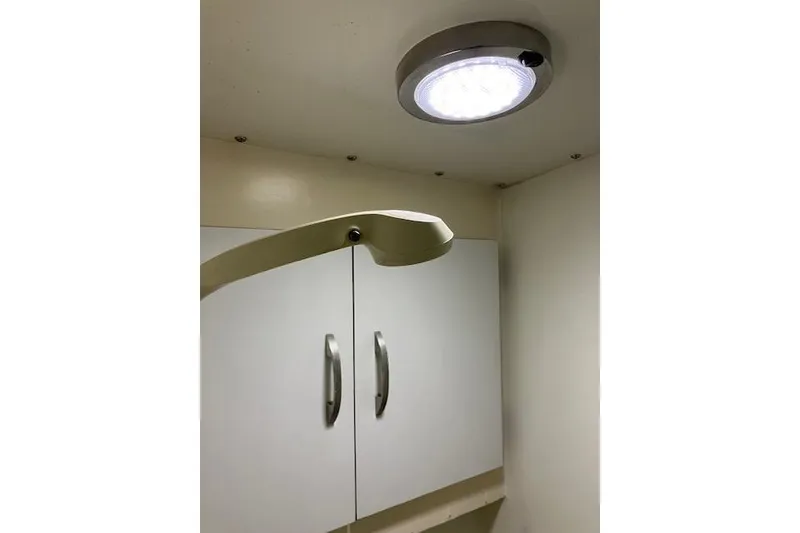 Slide: The Image of Interior of 1979 Pacemaker 40 Sportfisher with modern lighting and cabinetry. - 18