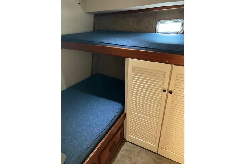 Slide: The Image of Interior of 1979 Pacemaker 40 Sportfisher with bunk beds and storage cabinet. - 20