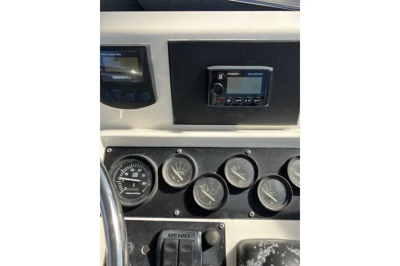 Slide: The Image of Dashboard of a 1979 Pacemaker 40 Sportfisher with gauges and controls. - 28