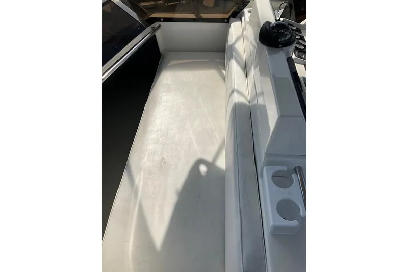 Slide: The Image of 1979 Pacemaker 40 Sportfisher interior with seating and cup holders, showcasing clean design. - 30