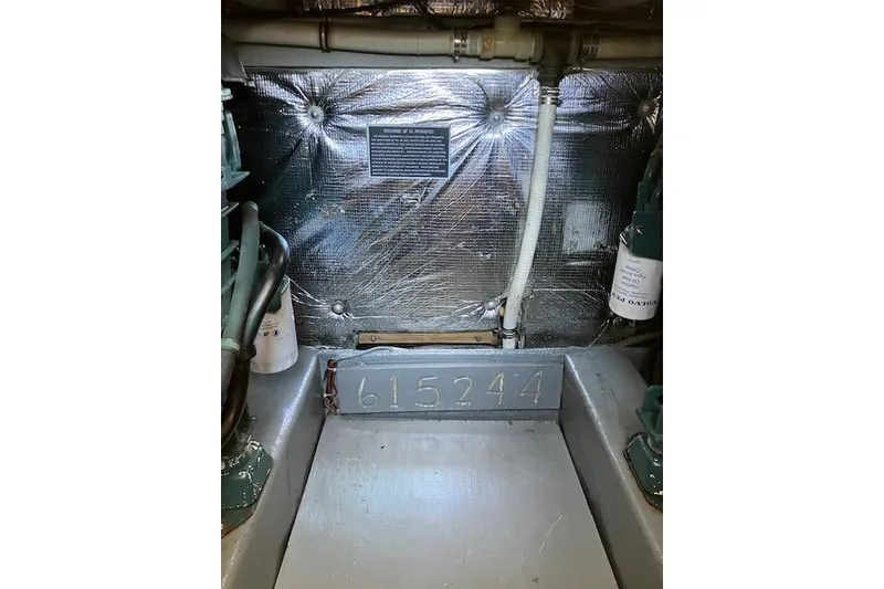 Slide: The Image of Engine room of 1979 Pacemaker 40 Sportfisher with serial number 615244 visible. - 43