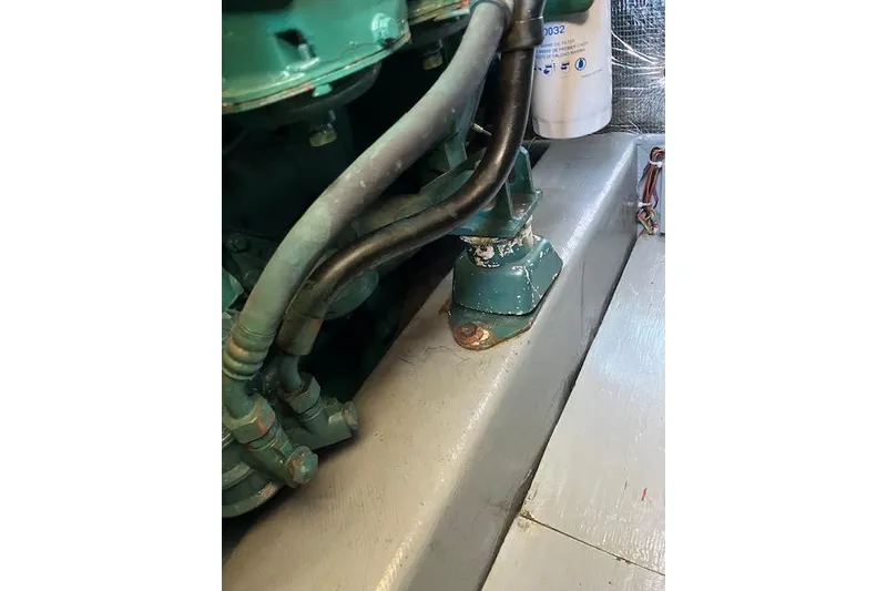 Slide: The Image of Engine compartment of a 1979 Pacemaker 40 Sportfisher boat, showing hoses and components. - 45