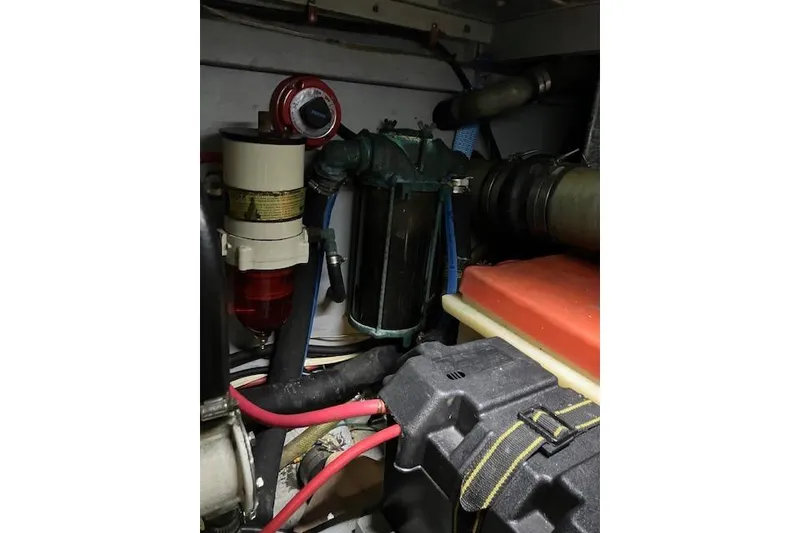 Slide: The Image of Engine room of 1979 Pacemaker 40 Sportfisher with visible components and wiring. - 48
