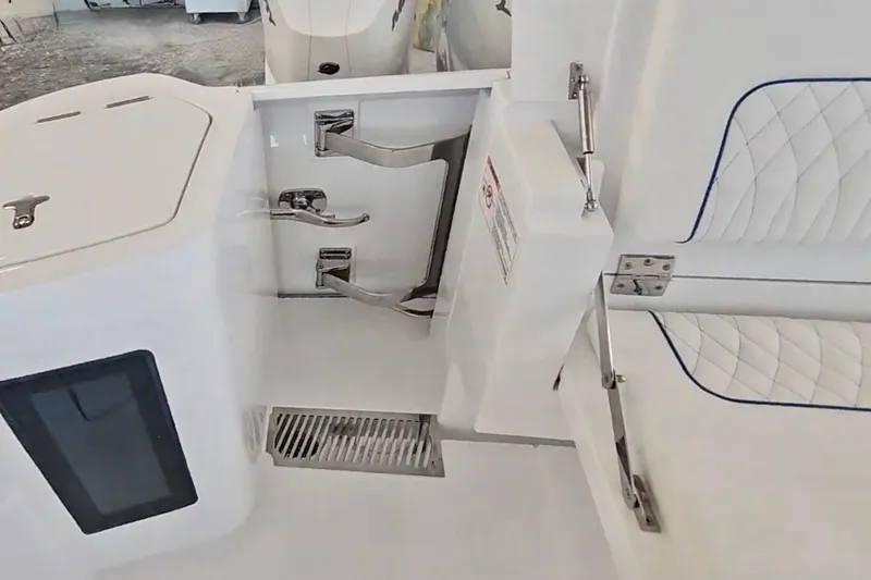 Slide: The Image of 2025 Intrepid 43 Nomad SE boat interior with quilted white seating. - 11