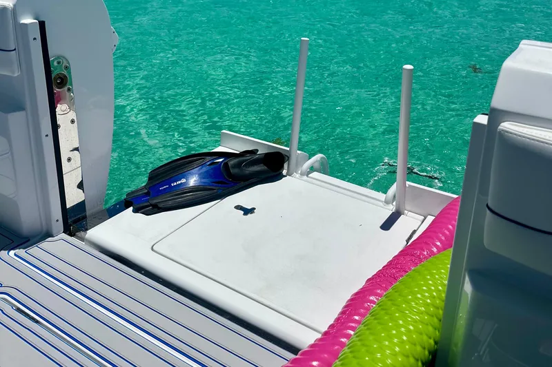 Slide: The Image of 2025 Intrepid 43 Nomad SE boat interior with storage compartments and control panel. - 14