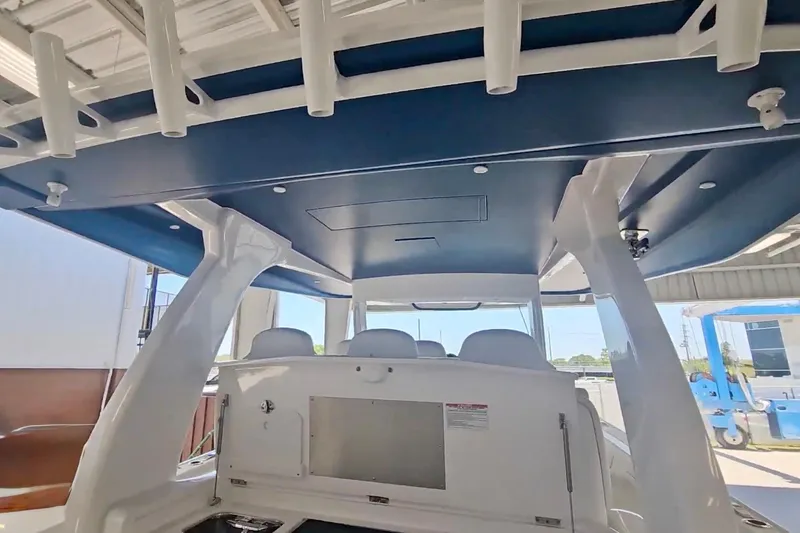 Slide: The Image of Engine compartment of 2025 Intrepid 43 Nomad SE boat, showcasing mechanical components. - 18