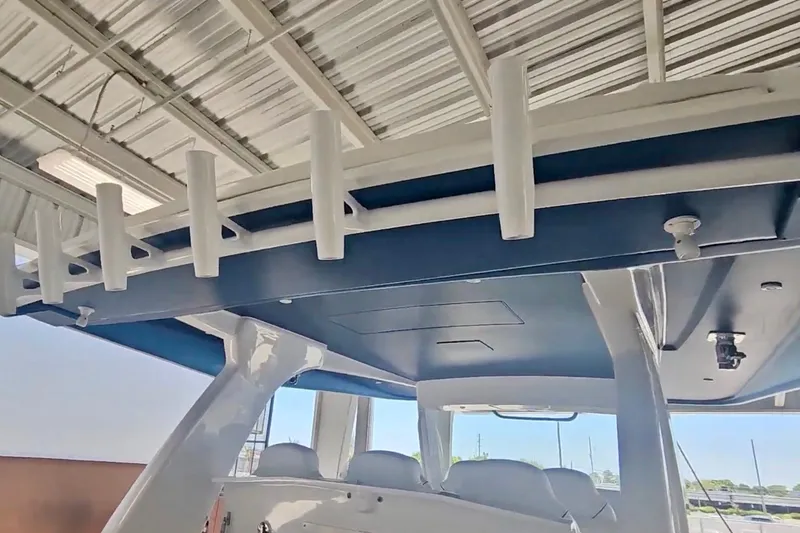 Slide: The Image of 2025 Intrepid 43 Nomad SE boat galley with grill, sink, and storage compartments. - 19