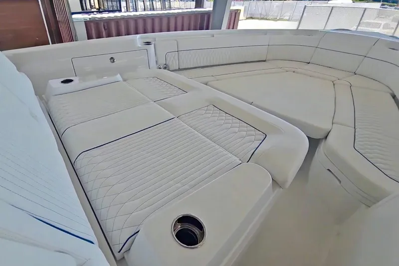 Slide: The Image of 2025 Intrepid 43 Nomad SE boat interior with rod holders and sleek design. - 21