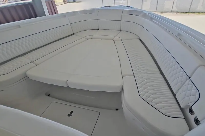 Slide: The Image of 2025 Intrepid 43 Nomad SE boat interior with storage compartments and sleek design. - 22