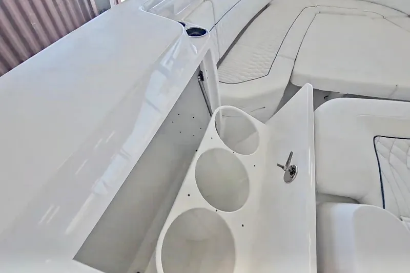 Slide: The Image of 2025 Intrepid 43 Nomad SE boat interior with luxurious white seating. - 26