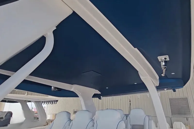 Slide: The Image of Intrepid 43 Nomad SE 2025 boat interior storage compartment with sleek design. - 29