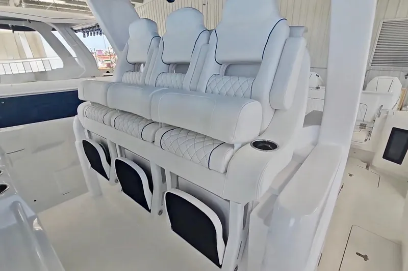 Slide: The Image of 2025 Intrepid 43 Nomad SE boat interior with sleek seating and modern design. - 31