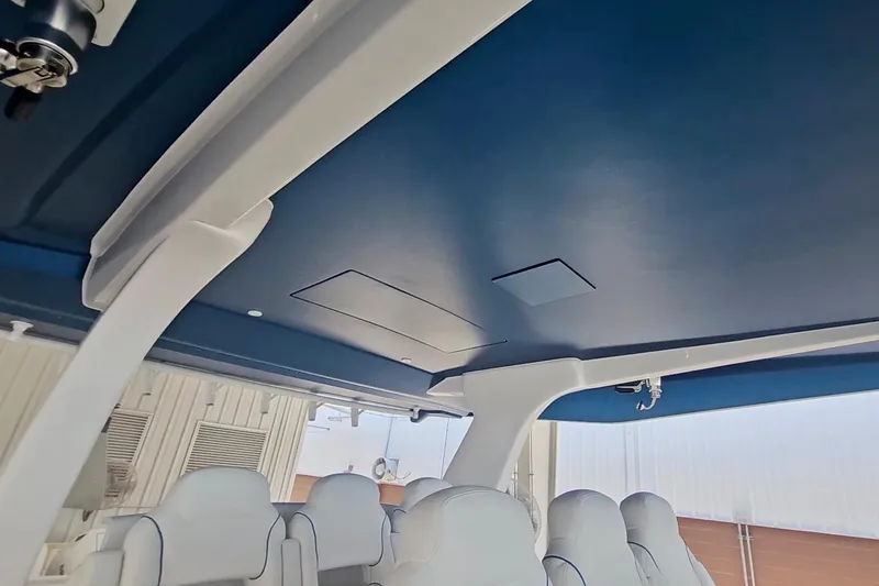 Slide: The Image of Control panel of 2025 Intrepid 43 Nomad SE boat with Mercury controls. - 35