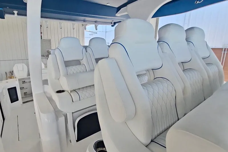 Slide: The Image of 2025 Intrepid 43 Nomad SE helm with modern controls and sleek steering wheel. - 36