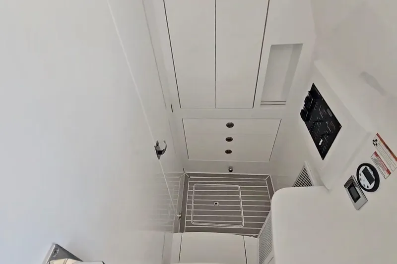 Slide: The Image of Luxurious seating on 2025 Intrepid 43 Nomad SE boat, featuring elegant white upholstery. - 38