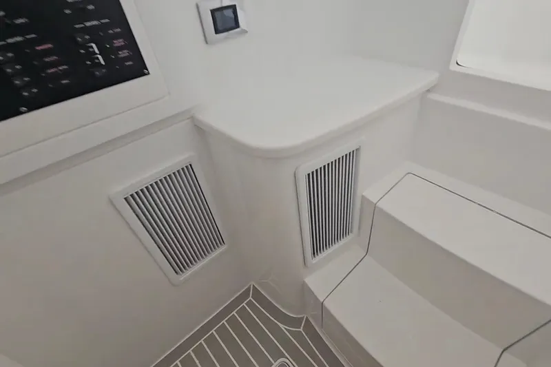 Slide: The Image of 2025 Intrepid 43 Nomad SE boat interior, showcasing sleek design and spacious seating. - 39