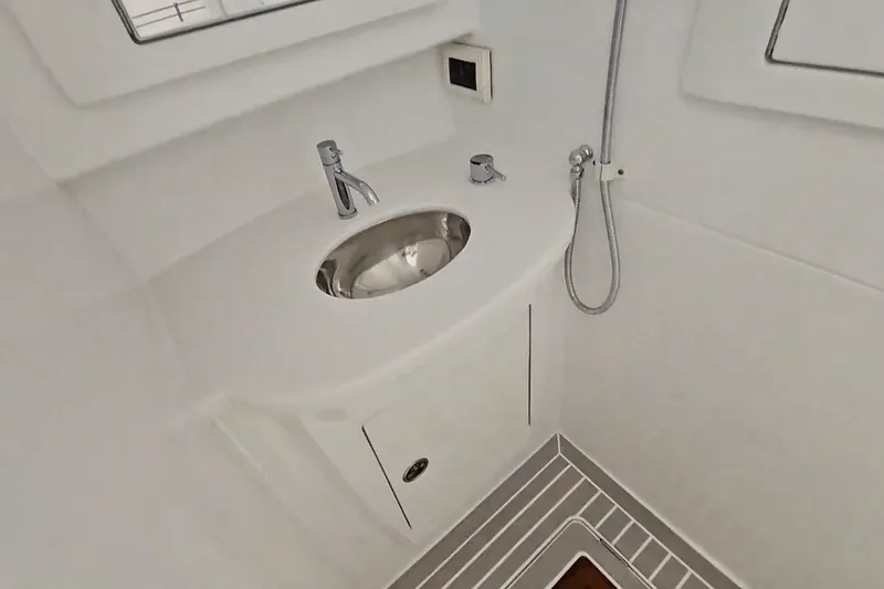Slide: The Image of Shower area inside 2025 Intrepid 43 Nomad SE boat, featuring modern fixtures and ventilation. - 45