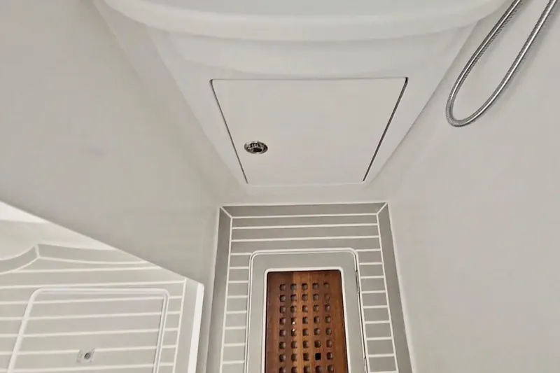 Slide: The Image of Bathroom interior of 2025 Intrepid 43 Nomad SE yacht, featuring modern fixtures and sleek design. - 46